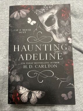 Haunting Adeline by H. D. Carlton - Black and Red Book Cover